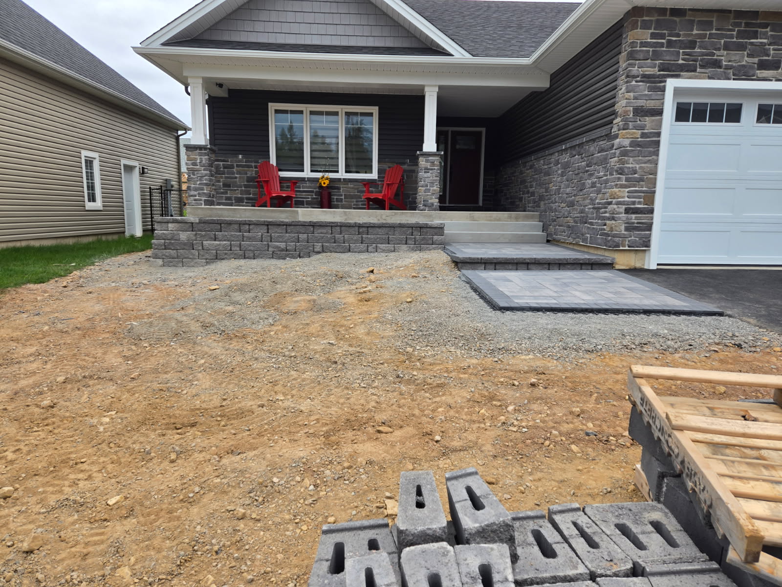 New home with retaining wall and paver steps