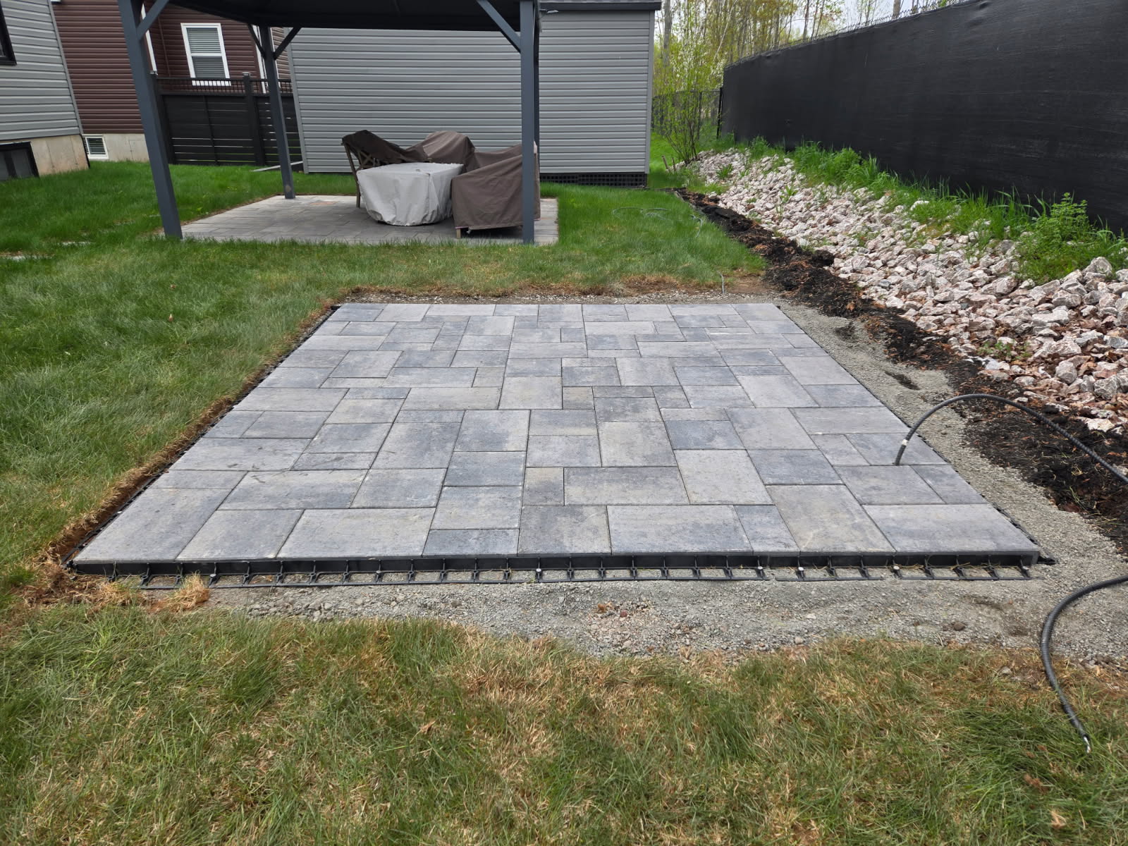 Freshly installed backyard paver patio